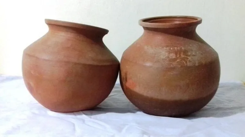 Mud Pots - Natural Benefits of Traditional Clay Pots A pair of mud pots crafted from clay, known for their natural benefits like keeping water cool and enhancing food flavors, blending tradition with health.